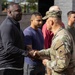 U.S. Army Brig. Gen. Leland D. Blanchard presents a coin to a U.S. Soldier