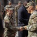 U.S. Army Brig. Gen. Leland D. Blanchard presents a coin to a U.S. Soldier