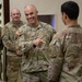 U.S. Army Brig. Gen. Leland D. Blanchard presents a coin to a U.S. Soldier
