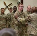 U.S. Army Command Sgt. Maj. Ronald L. Smith Jr. presents a coin to a U.S. Soldier