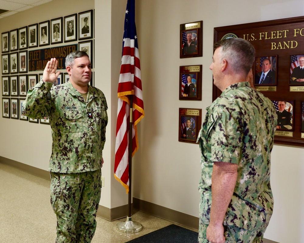 MU2 Patrick Melton reenlists in the United States Navy