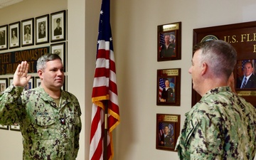 MU2 Patrick Melton reenlists in the United States Navy