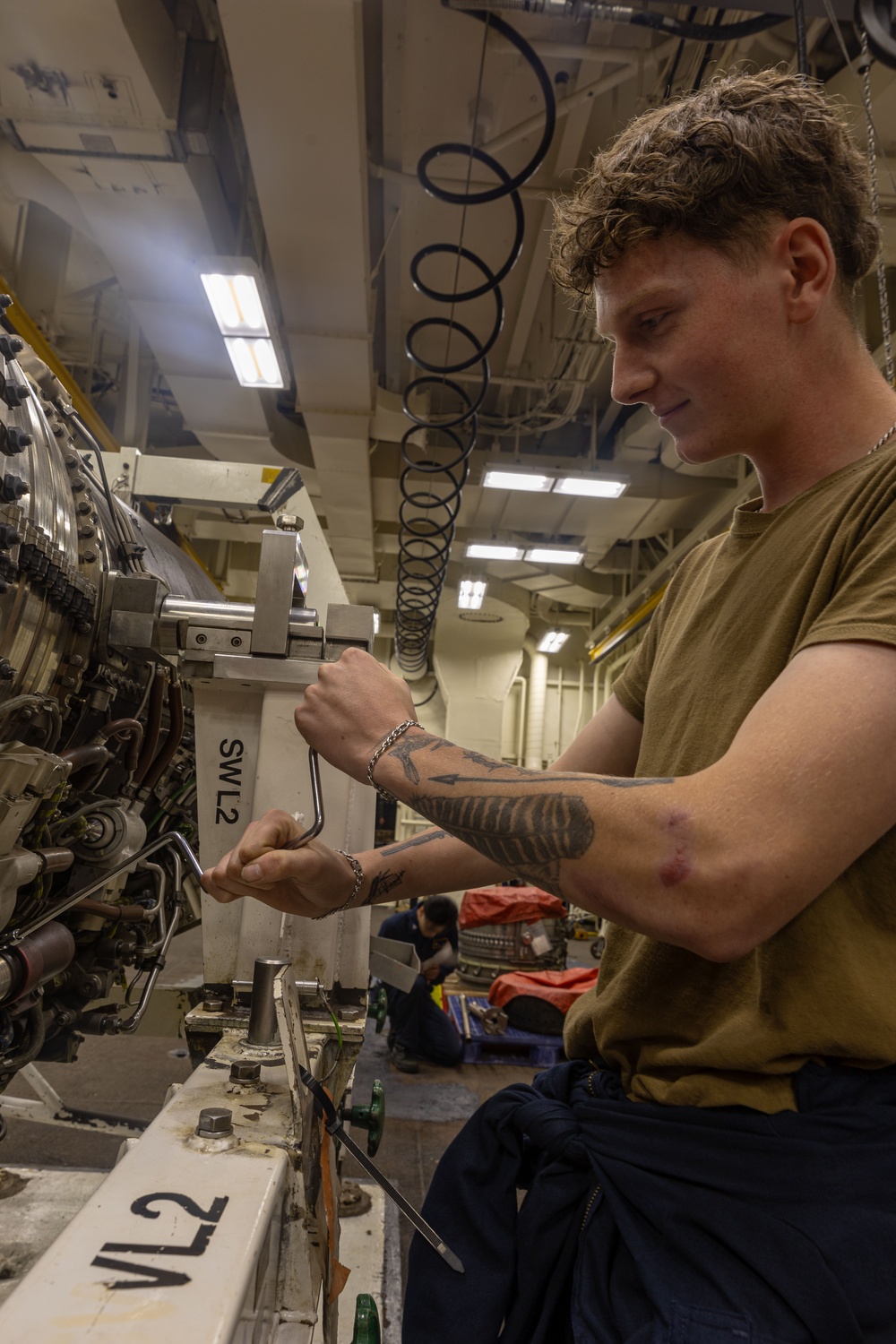 USS Gerald R. Ford (CVN 78) Sailor Conducts Jet Engine Maintenance