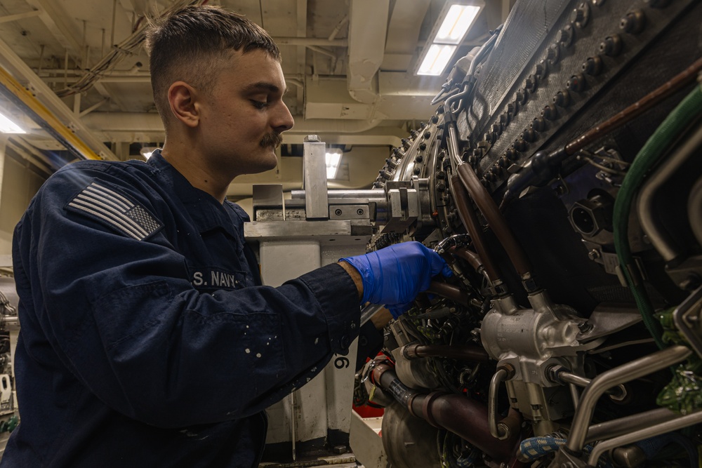 USS Gerald R. Ford (CVN 78) Sailor Conducts Jet Engine Maintenance