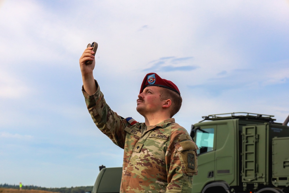 Guardian of the Winds: Rigger’s Vigilance Shields Allied Paratroopers from Unseen Dangers