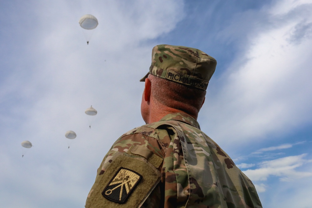 Eyes to the Sky: U.S. Commander Observes Allied Descent Over Historic Drop Zone