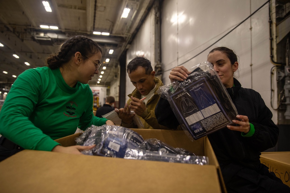 USS Gerald R. Ford (CVN 78) Sailors Sort Stores