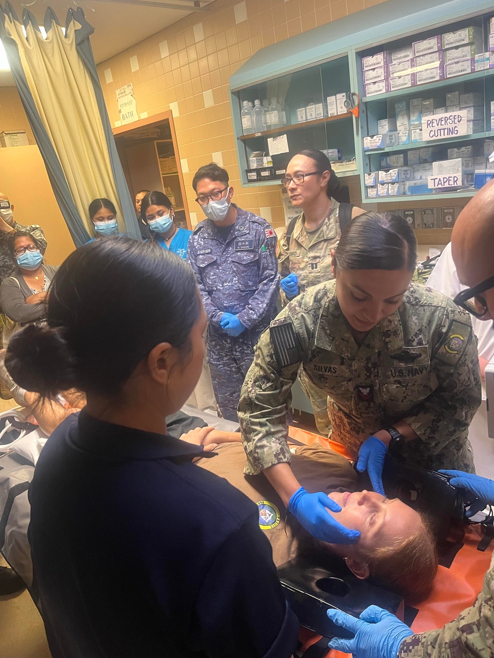 Multinational medical professionals and Palaun medical professionals participate in a simulated trauma training and air evacuation exercise, Sept. 23