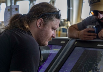 USS Frank Cable (AS 40) departs Puerto Princesa, Philippines