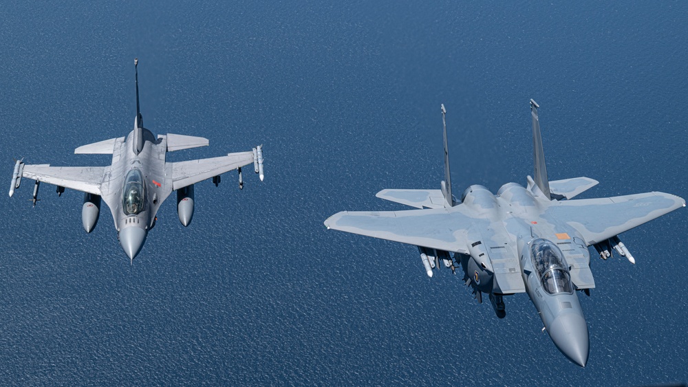 F-15EX Eagle II and F-16D Fighting Falcon fly over the Gulf of America