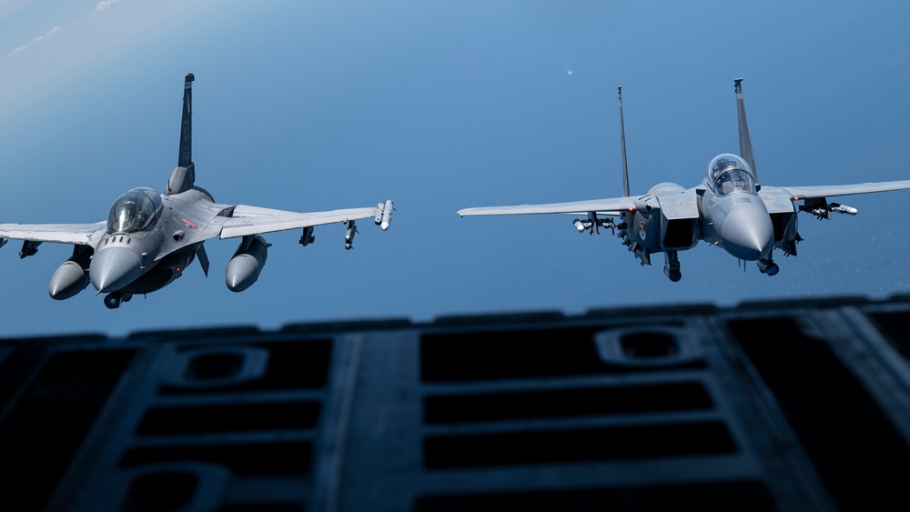 F-15EX Eagle II and F-16D Fighting Falcon fly over the Gulf of America