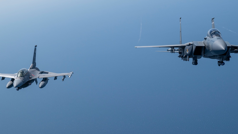 F-15EX Eagle II and F-16D Fighting Falcon fly over the Gulf of America
