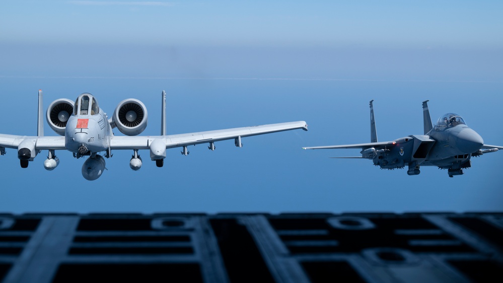 F-15EX Eagle II and F-16D Fighting Falcon fly over the Gulf of America