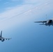 F-15EX Eagle II and F-16D Fighting Falcon fly over the Gulf of America