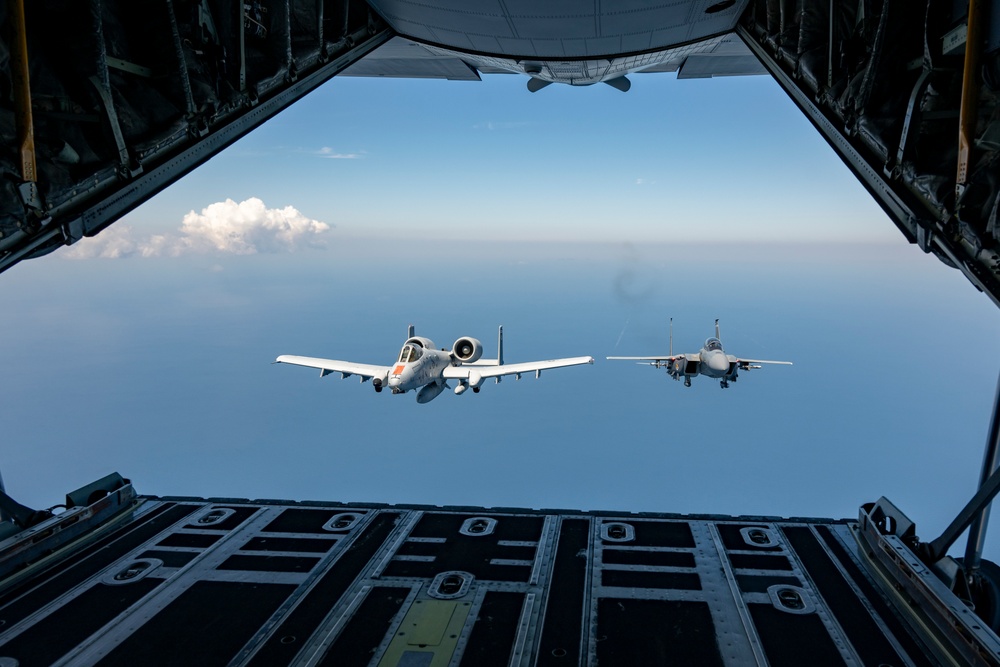 F-15EX Eagle II and A-10C Thunderbolt II fly over the Gulf of America