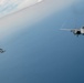 F-15EX Eagle II and F-16D Fighting Falcon fly over the Gulf of America