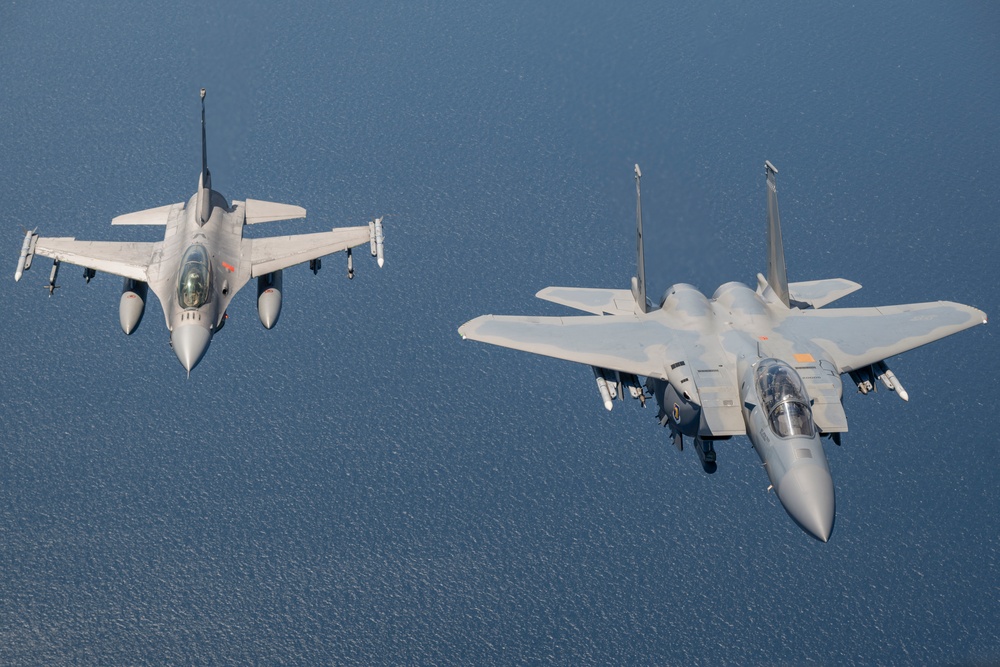 F-15EX Eagle II and F-16D Fighting Falcon fly over the Gulf of America
