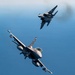 F-15EX Eagle II and F-16D Fighting Falcon fly over the Gulf of America