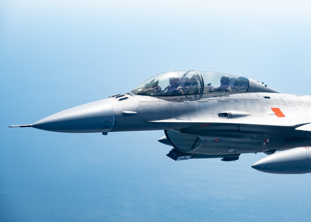 An F-16D flies over the Gulf of America