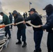 USS Bulkeley (DDG 84) Sailors heave in a mooring line while conducting a sea-and-anchor