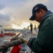 STG3 Iyan Rosales ties off a heaving ball line to a mooring line while conducting a sea-and-anchor evolution