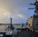 USS Bulkeley (DDG 84) is maneuvered out of port by two tug boats