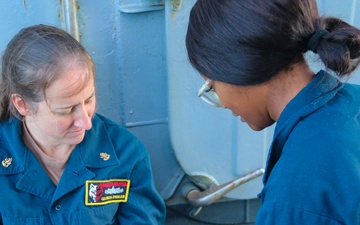 STGC Gloria Dibler and LS2 Desamoure Stanisha demonstrate medical treatment of personnel during a simulated mass casualty drill