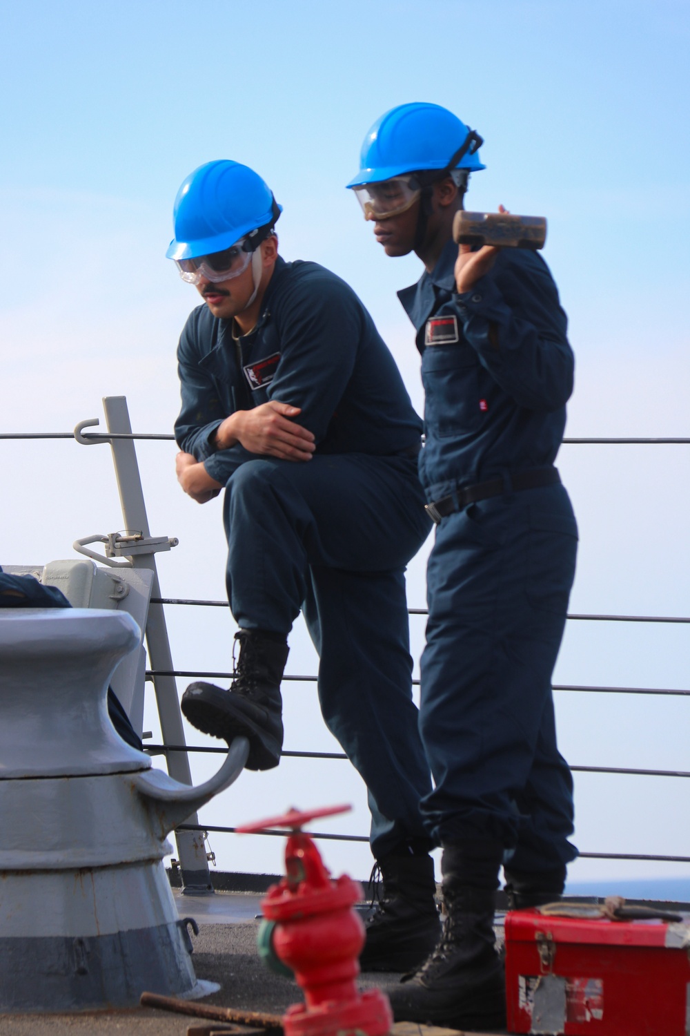 BM3 Jamesmark Monje and SR Judrious Andrus release the anchor chain during an anchor drop test BM3 Jamesmark Monje and SR Judrious Andrus release the anchor chain during an anchor drop test