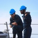 BM3 Jamesmark Monje and SR Judrious Andrus release the anchor chain during an anchor drop test