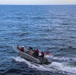 USS Bulkeley (DDG 84) Sailors maneuver on a rigid hulled inflatable boat