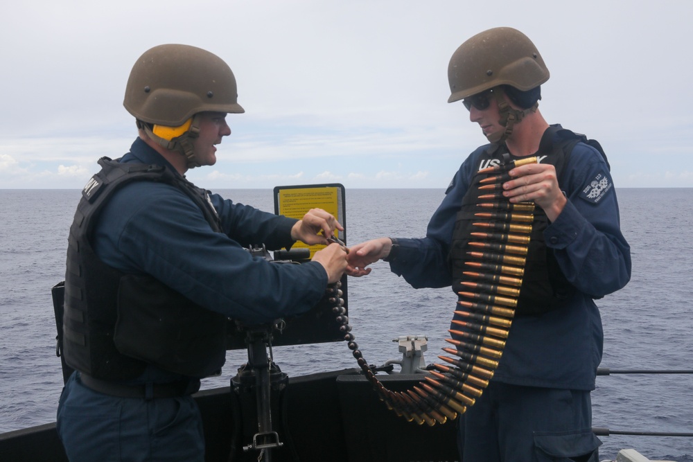 Sailors aboard the USS John Finn conduct a gun shoot in the South China Sea