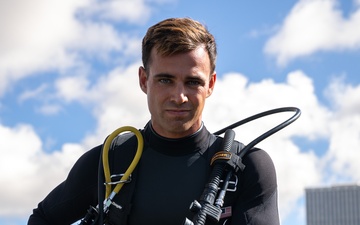 U.S. Coast Guard divers conduct aids to navigation maintenance