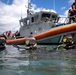 U.S. Coast Guard divers conduct aids to navigation maintenance