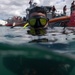 U.S. Coast Guard divers conduct aids to navigation maintenance