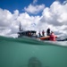 U.S. Coast Guard divers conduct aids to navigation maintenance