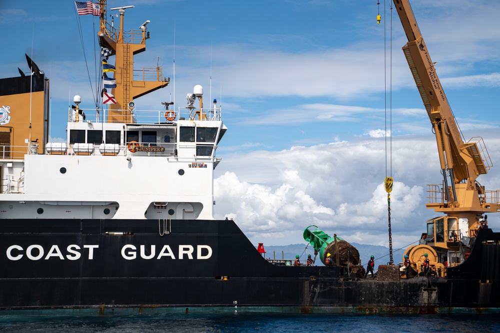 U.S. Coast Guard Cutter Juniper conducts maintenance on channel buoys
