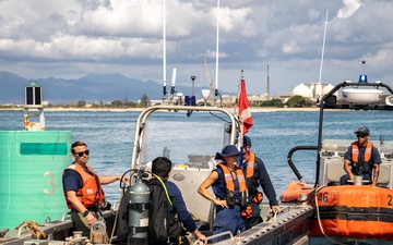 U.S. Coast Guard Cutter Juniper conducts maintenance on channel buoys