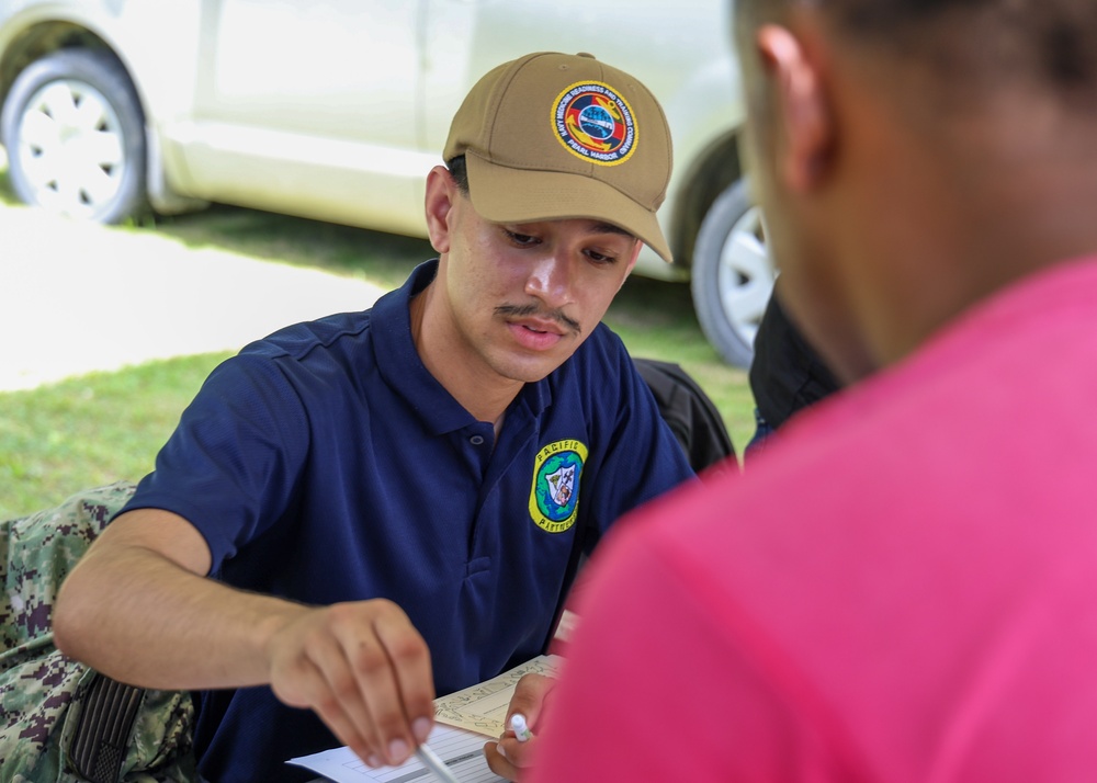 Hospitalman Rajvir Bassi, educates locals about the importance of personal health during Pacific Partnership 2025.