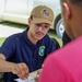 Hospitalman Rajvir Bassi, educates locals about the importance of personal health during Pacific Partnership 2025.