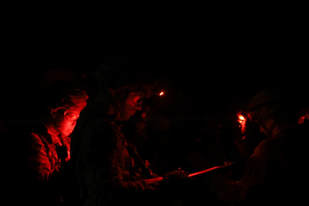 A U.S. Army Soldier Plots Points in Pursuit of Army Expert Badge