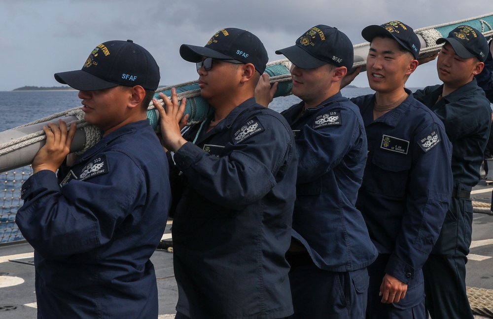 Sailors aboard the USS John Finn conduct a sea and anchor detail in Okinawa, Japan