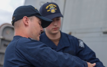 Sailors aboard the USS John Finn conduct a sea and anchor detail in Okinawa, Japan