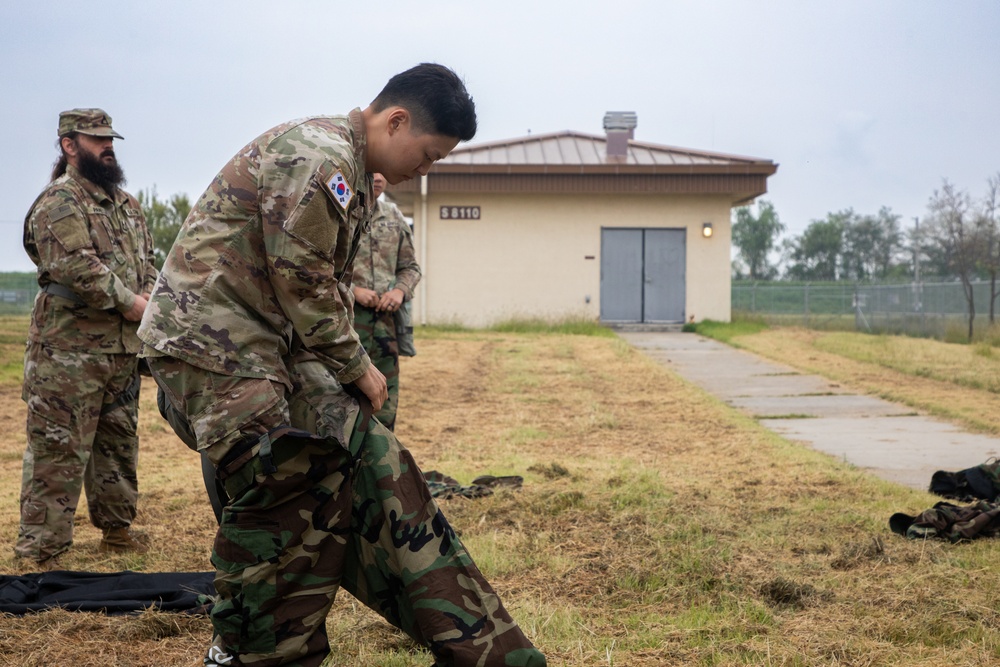 U.S. Army Soldiers, KATUSAs, and Civilians From USANEC-Humphreys 41st Signal Battalion Conduct CBRN Training