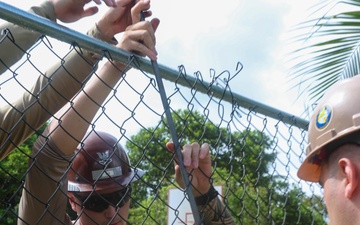 Multinational service members help make repairs at Aimeliik Elementary School