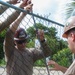 Multinational service members help make repairs at Aimeliik Elementary School