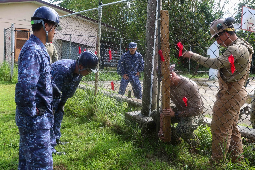 Multinational service members help make repairs at Aimeliik Elementary School