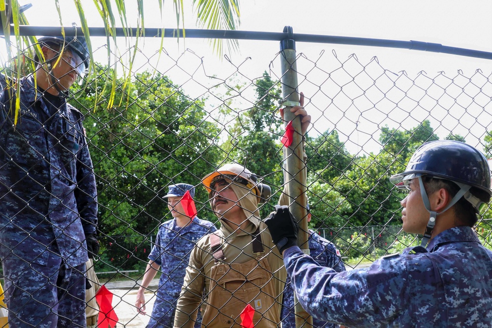Multinational service members help make repairs at Aimeliik Elementary School