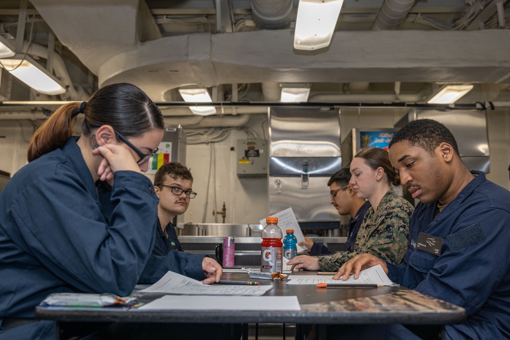 Sailors take the E-5 examination on board USS Iwo Jima (LHD 7)