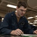 Sailors take the E-5 examination on board USS Iwo Jima (LHD 7)