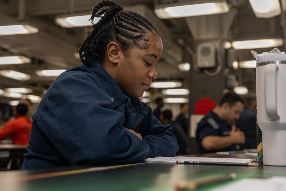 Sailors take the E-5 examination on board USS Iwo Jima (LHD 7)